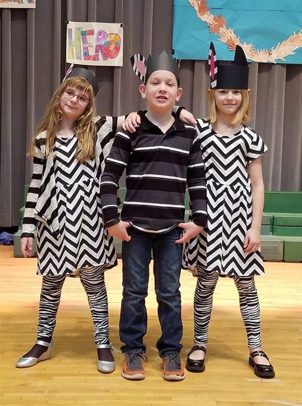 Three students standing Three students standing